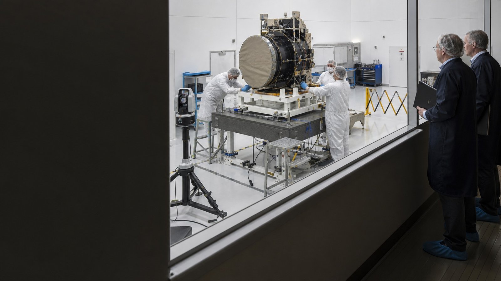 Reviewers conducting representative pre-flight diligence around a non-flight payload test article